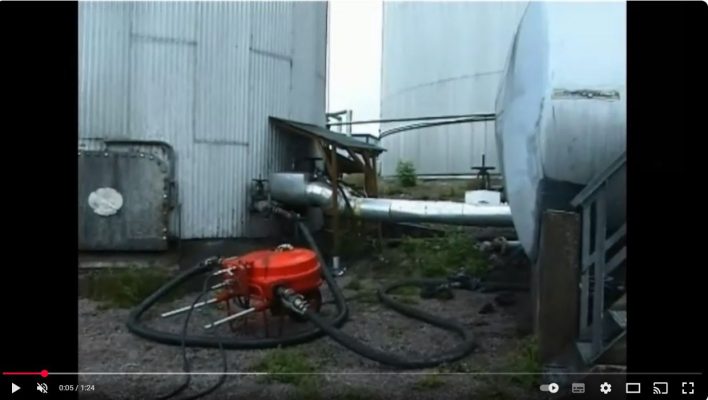 Clean out of Sludge from a bottom valve of a large on shore tank